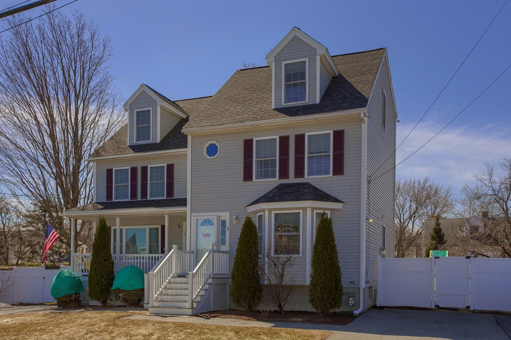 13 Golf Avenue, Unit 13 Methuen, MA 01844 - Photo 2 of 30 a front view of a house with a yard