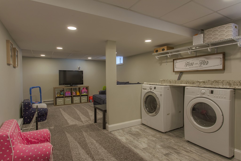 13 Golf Avenue, Unit 13 Methuen, MA 01844 - Photo 24 of 30 a view of a livingroom with washer and dryer