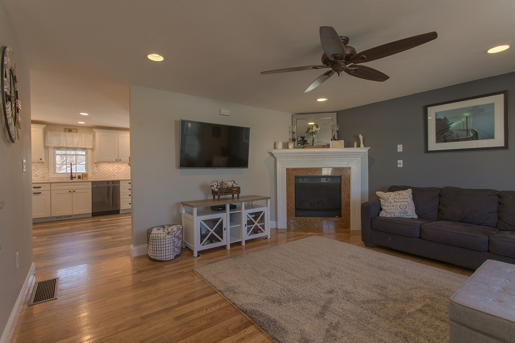 13 Golf Avenue, Unit 13 Methuen, MA 01844 - Photo 3 of 30 a living room with furniture and a flat screen tv