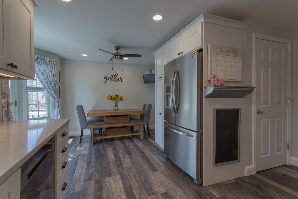 13 Golf Avenue, Unit 13 Methuen, MA 01844 - Photo 7 of 30 a kitchen with stainless steel appliances a refrigerator and a stove top oven
