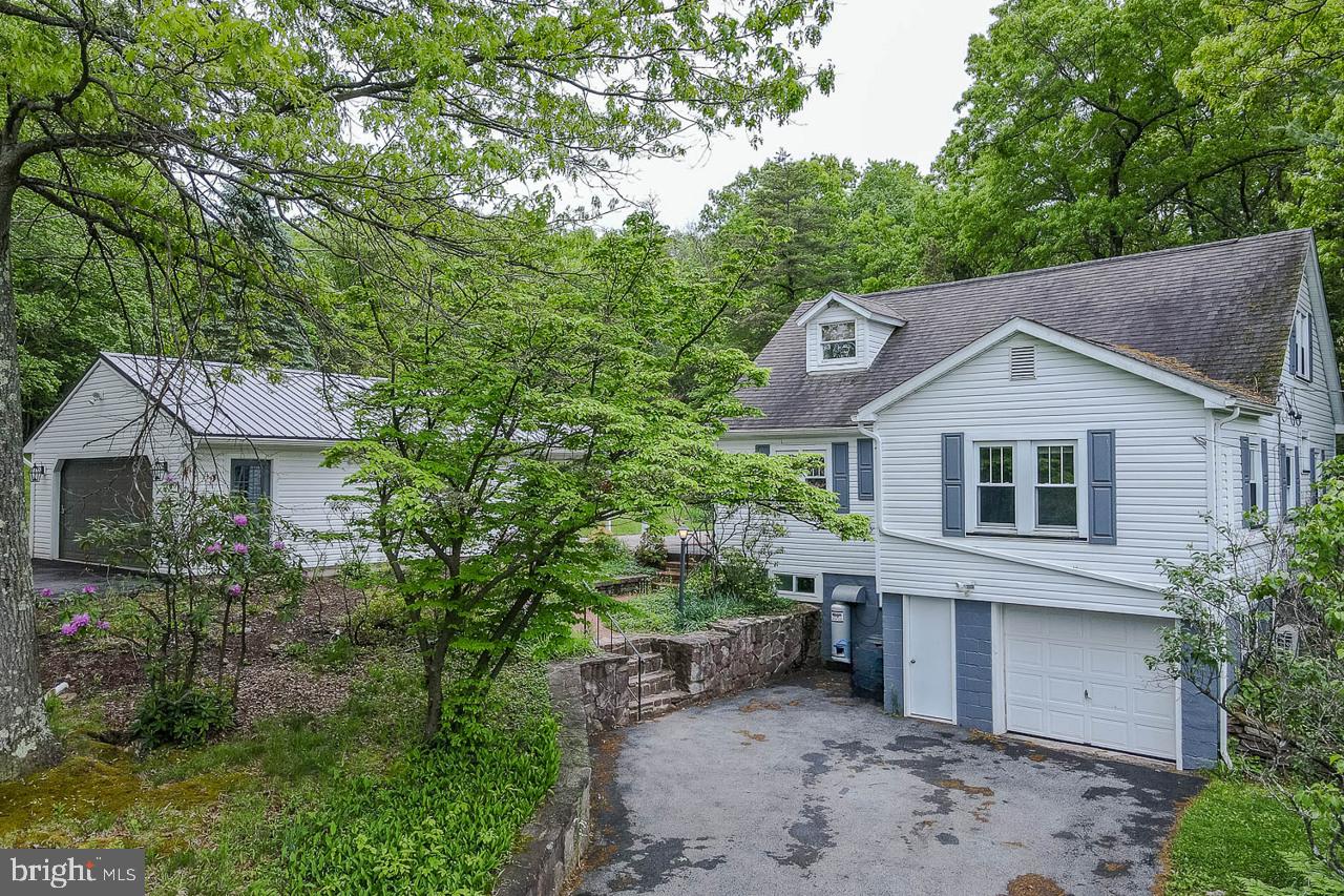 1834 Decker Hollow Road Tyrone, PA 16686 - Photo 7 of 40 a view of a house with a yard and plants