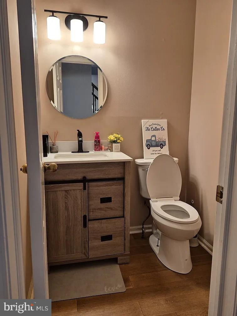 262 Tulip Tree Court Blue Bell, PA 19422 - Photo 15 of 32 a bathroom with a toilet sink vanity and mirror