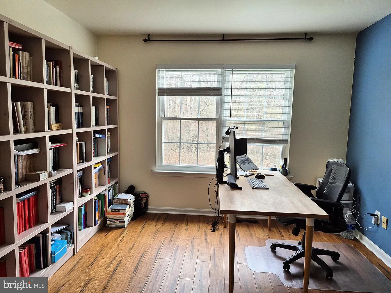 262 Tulip Tree Court Blue Bell, PA 19422 - Photo 19 of 32 a view of a workspace with furniture and a bookshelf