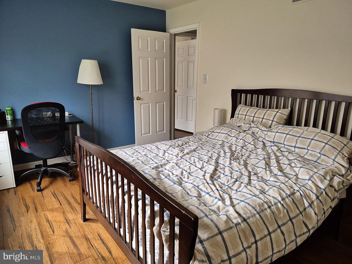 262 Tulip Tree Court Blue Bell, PA 19422 - Photo 21 of 32 a bedroom with a bed and a chandelier