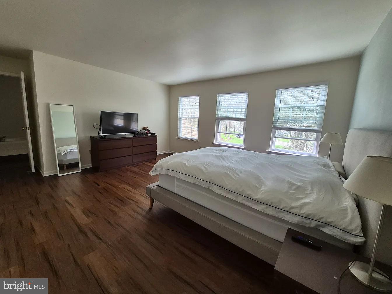 262 Tulip Tree Court Blue Bell, PA 19422 - Photo 23 of 32 a bedroom with a bed and wooden floor