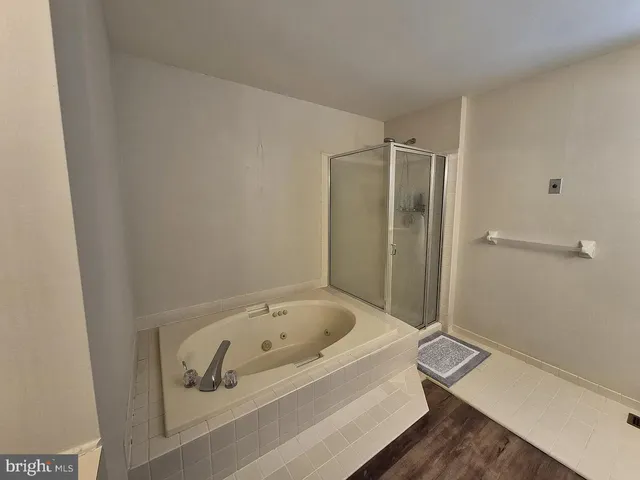 a bathroom with a bathtub and toilet