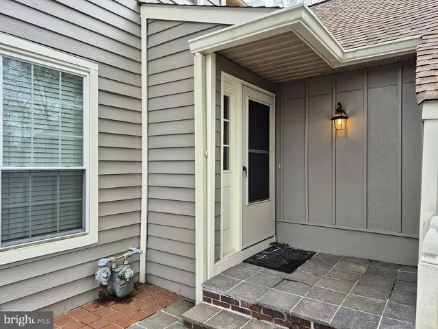 a view of a porch with wooden floor and fence
