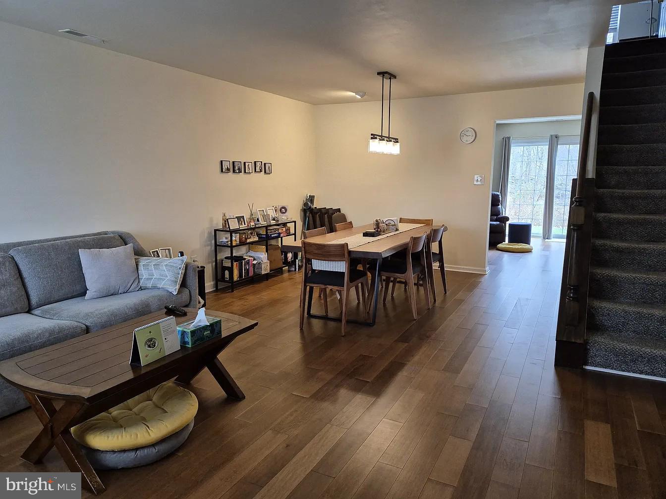 262 Tulip Tree Court Blue Bell, PA 19422 - Photo 5 of 32 a living room with furniture a table and wooden floor