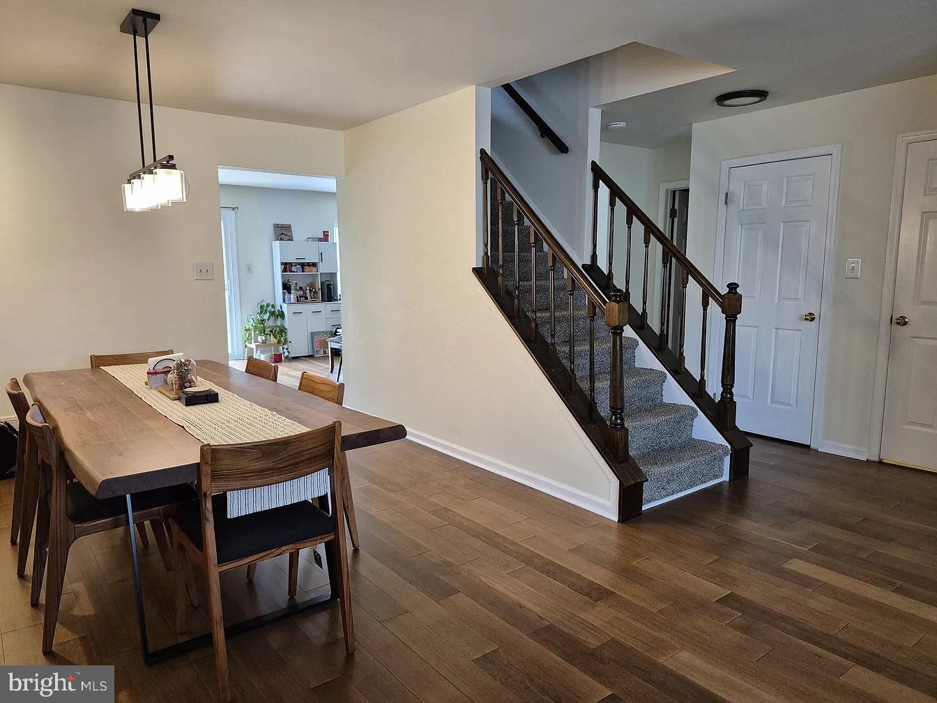 262 Tulip Tree Court Blue Bell, PA 19422 - Photo 6 of 32 a view of a dining room with furniture wooden floor and chandelier