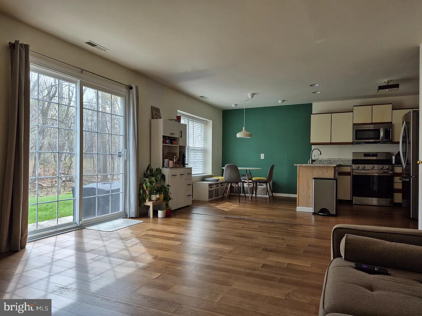 262 Tulip Tree Court Blue Bell, PA 19422 - Photo 9 of 32 a living room with furniture and a flat screen tv