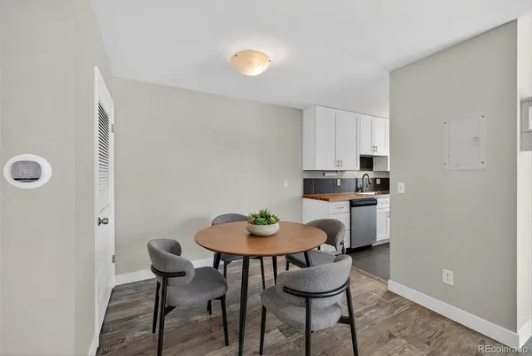 a view of a dining room with furniture and wooden floor