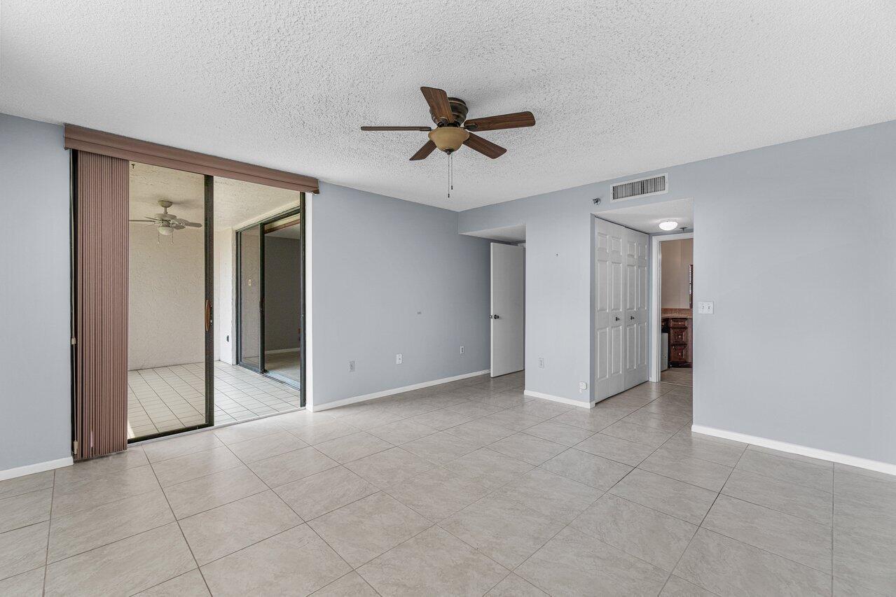 6530 Boca Del Mar Drive, Unit 336 Boca Raton, FL 33433 - Photo 12 of 22 an empty room with closet and a ceiling fan