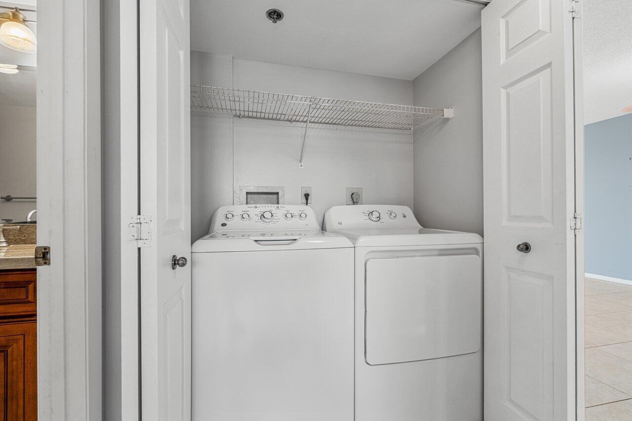 6530 Boca Del Mar Drive, Unit 336 Boca Raton, FL 33433 - Photo 17 of 22 a utility room with dryer and washer