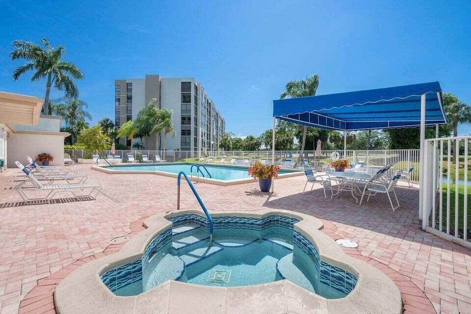 6530 Boca Del Mar Drive, Unit 336 Boca Raton, FL 33433 - Photo 21 of 22 a view of a swimming pool with a patio