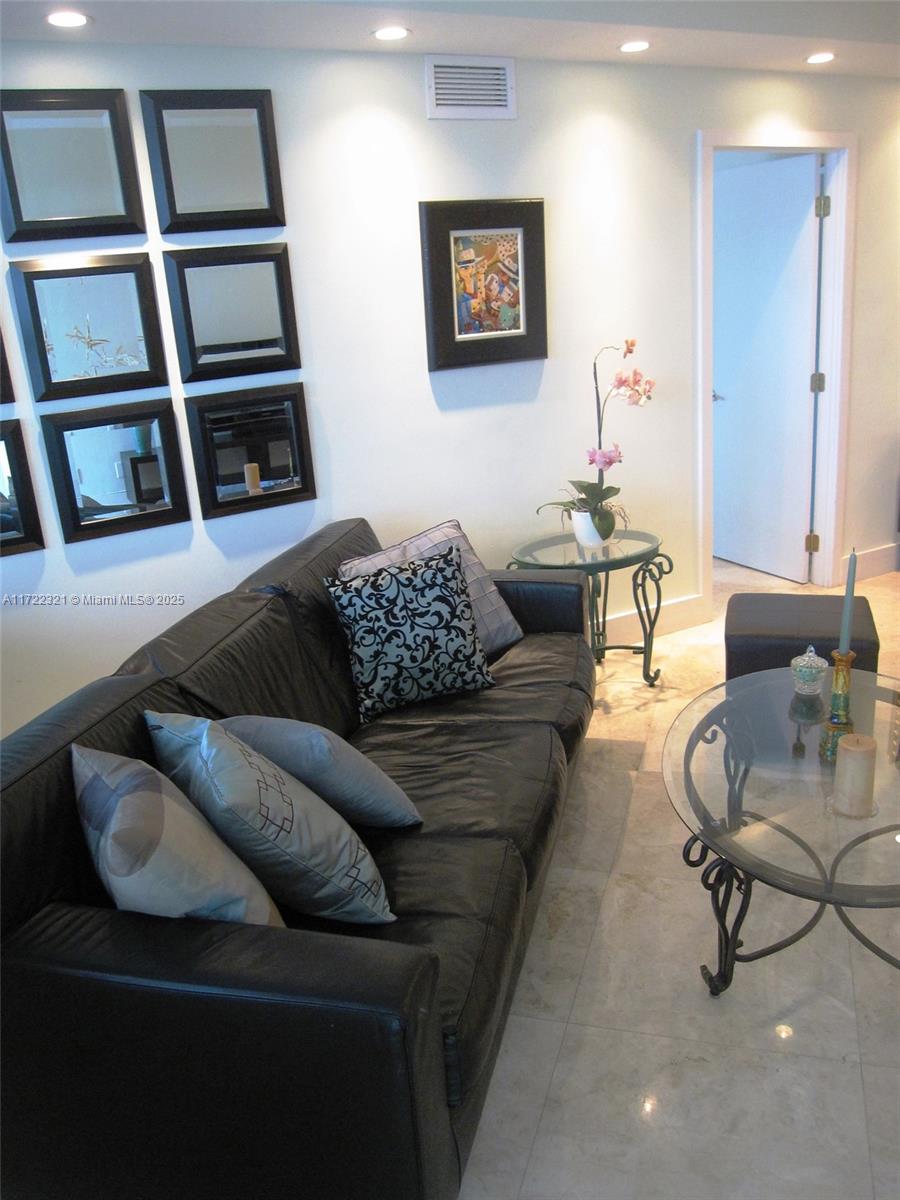 100 Lincoln Road, Unit 444 Miami Beach, FL 33139 - Photo 3 of 18 a living room with furniture and a window