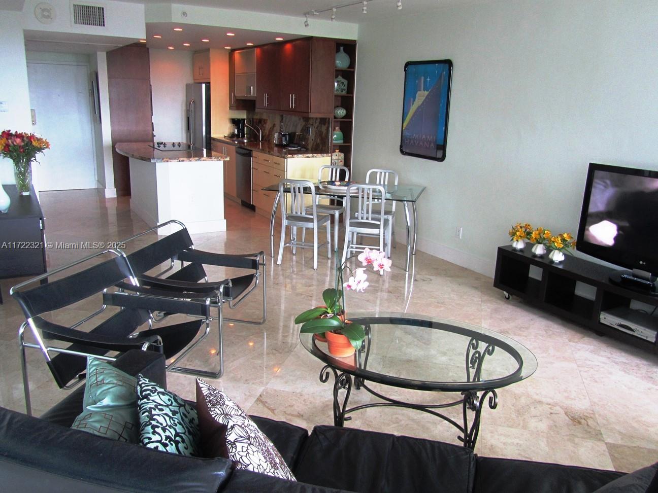 100 Lincoln Road, Unit 444 Miami Beach, FL 33139 - Photo 5 of 18 a living room with furniture