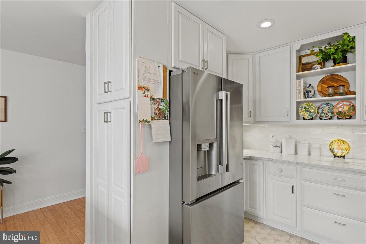 2409 Boston Street Baltimore, MD 21224 - Photo 19 of 46 a kitchen with stainless steel appliances granite countertop a refrigerator and a sink