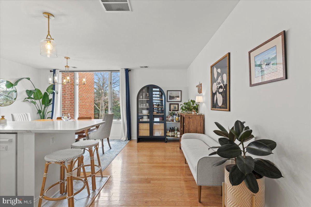 2409 Boston Street Baltimore, MD 21224 - Photo 21 of 46 a living room with furniture a potted plant and a large window