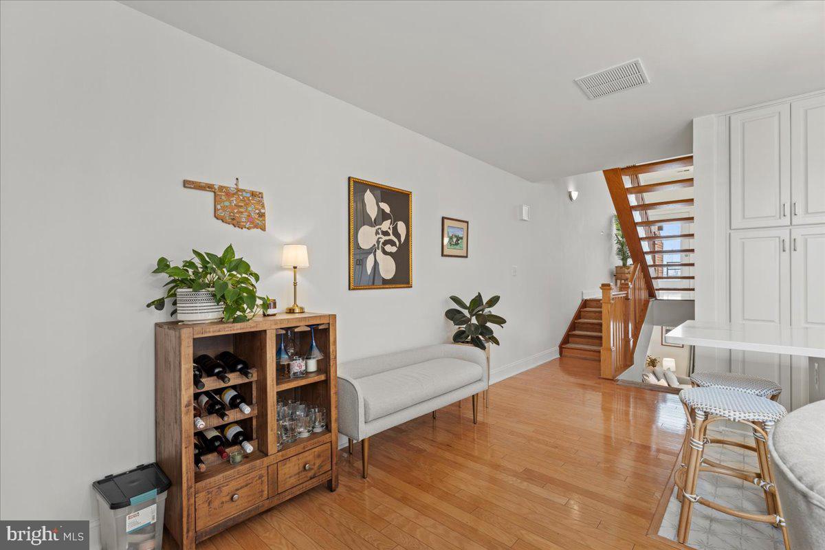 2409 Boston Street Baltimore, MD 21224 - Photo 22 of 46 a living room with furniture and wooden floor