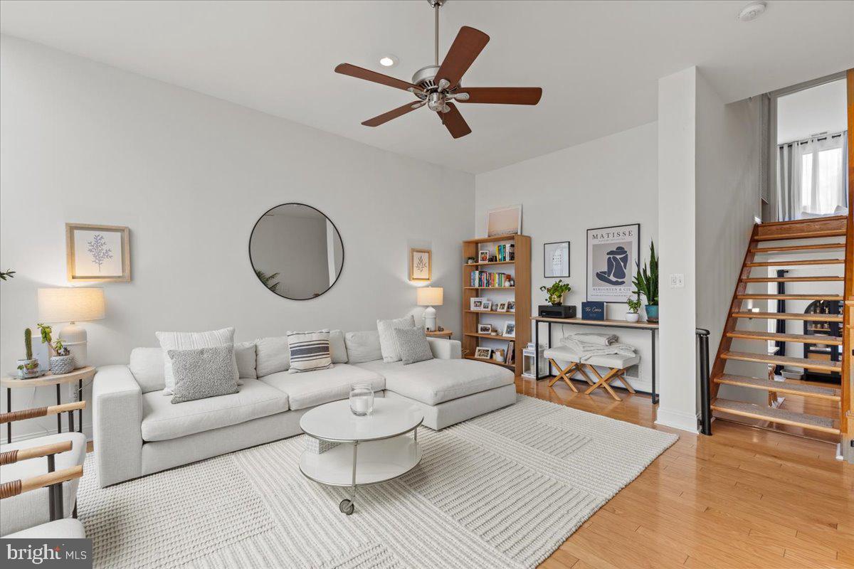 2409 Boston Street Baltimore, MD 21224 - Photo 26 of 46 a living room with furniture and a wooden floor