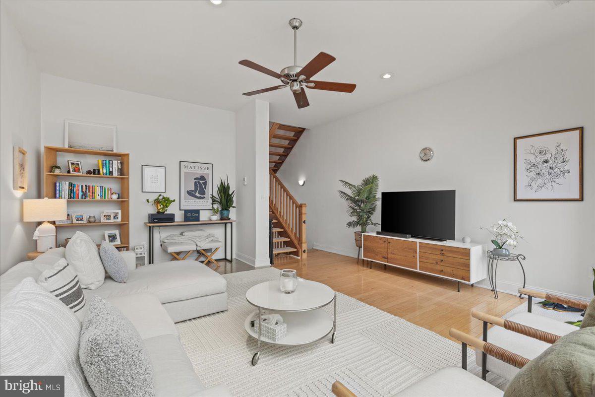 2409 Boston Street Baltimore, MD 21224 - Photo 27 of 46 a living room with furniture and a flat screen tv