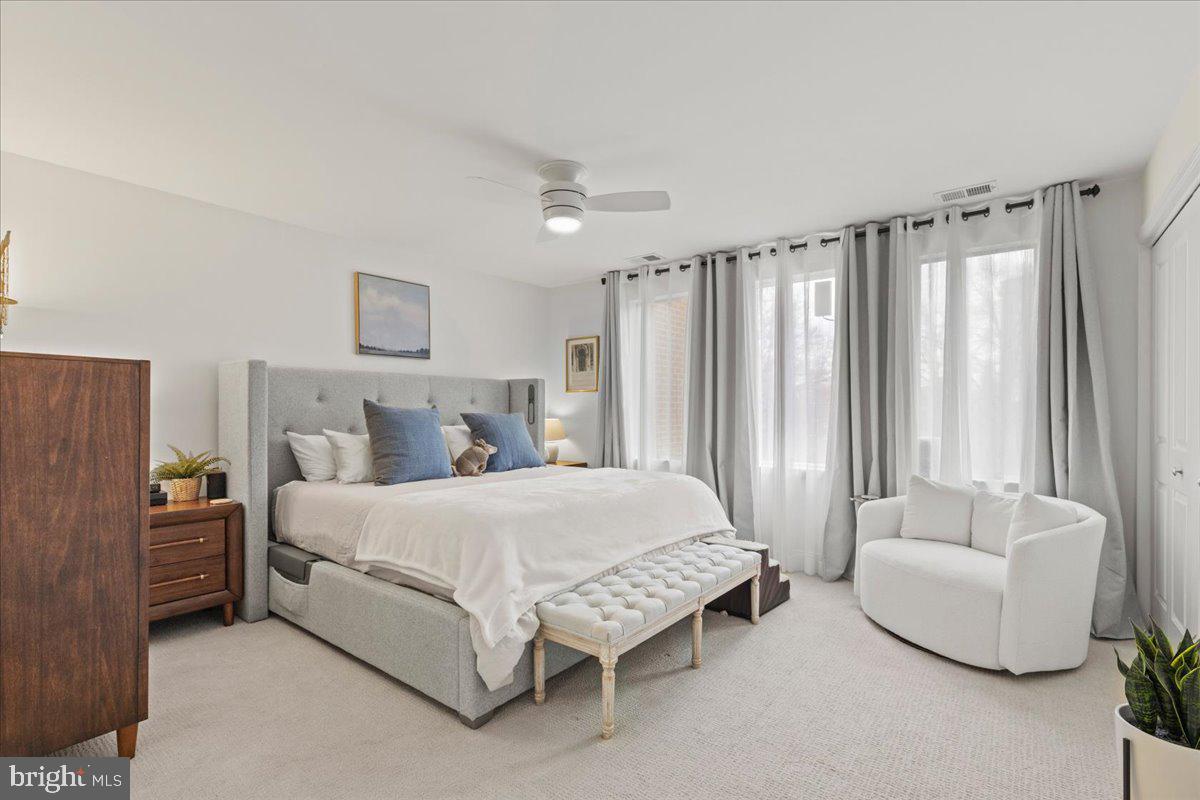 2409 Boston Street Baltimore, MD 21224 - Photo 31 of 46 a spacious bedroom with a bed and a couch