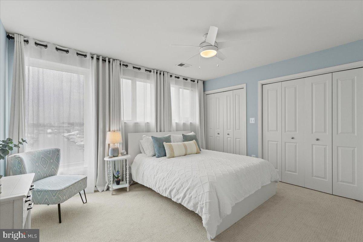 2409 Boston Street Baltimore, MD 21224 - Photo 38 of 46 a bedroom with a bed and a chair