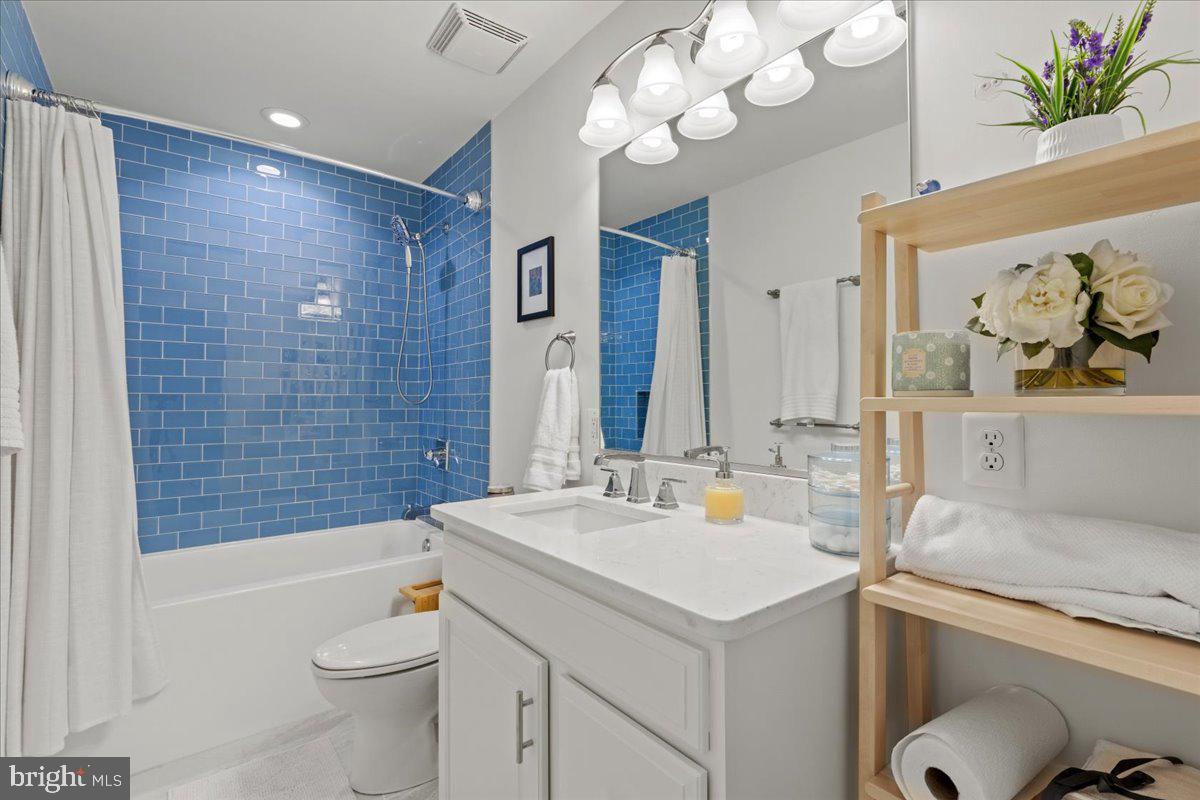 2409 Boston Street Baltimore, MD 21224 - Photo 42 of 46 a bathroom with a sink a toilet and shower