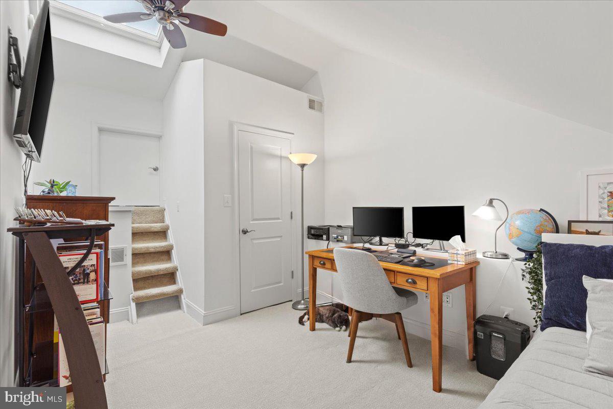 2409 Boston Street Baltimore, MD 21224 - Photo 43 of 46 a view of a workspace with furniture and a flat screen tv