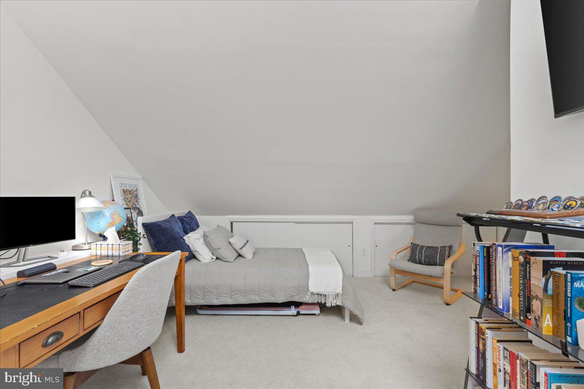 2409 Boston Street Baltimore, MD 21224 - Photo 44 of 46 a bedroom with a bed and a tv