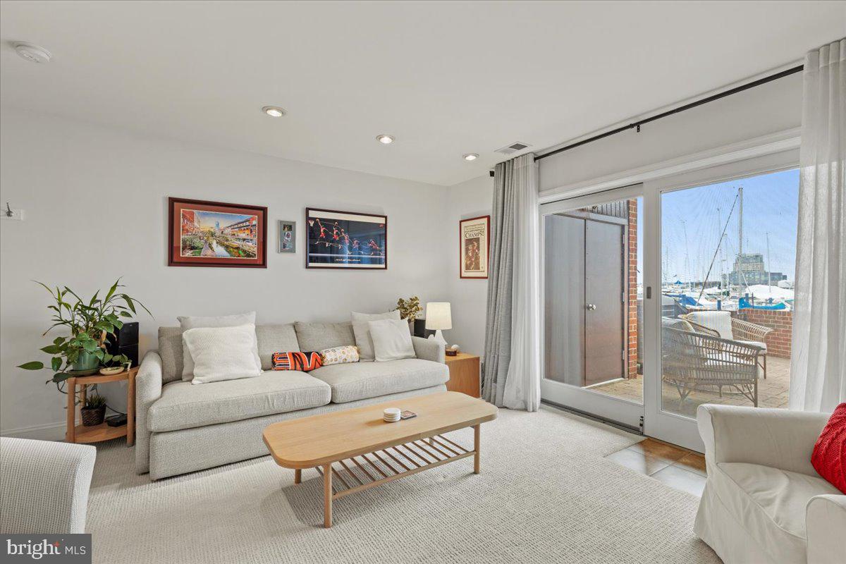 2409 Boston Street Baltimore, MD 21224 - Photo 7 of 46 a living room with furniture and a potted plant