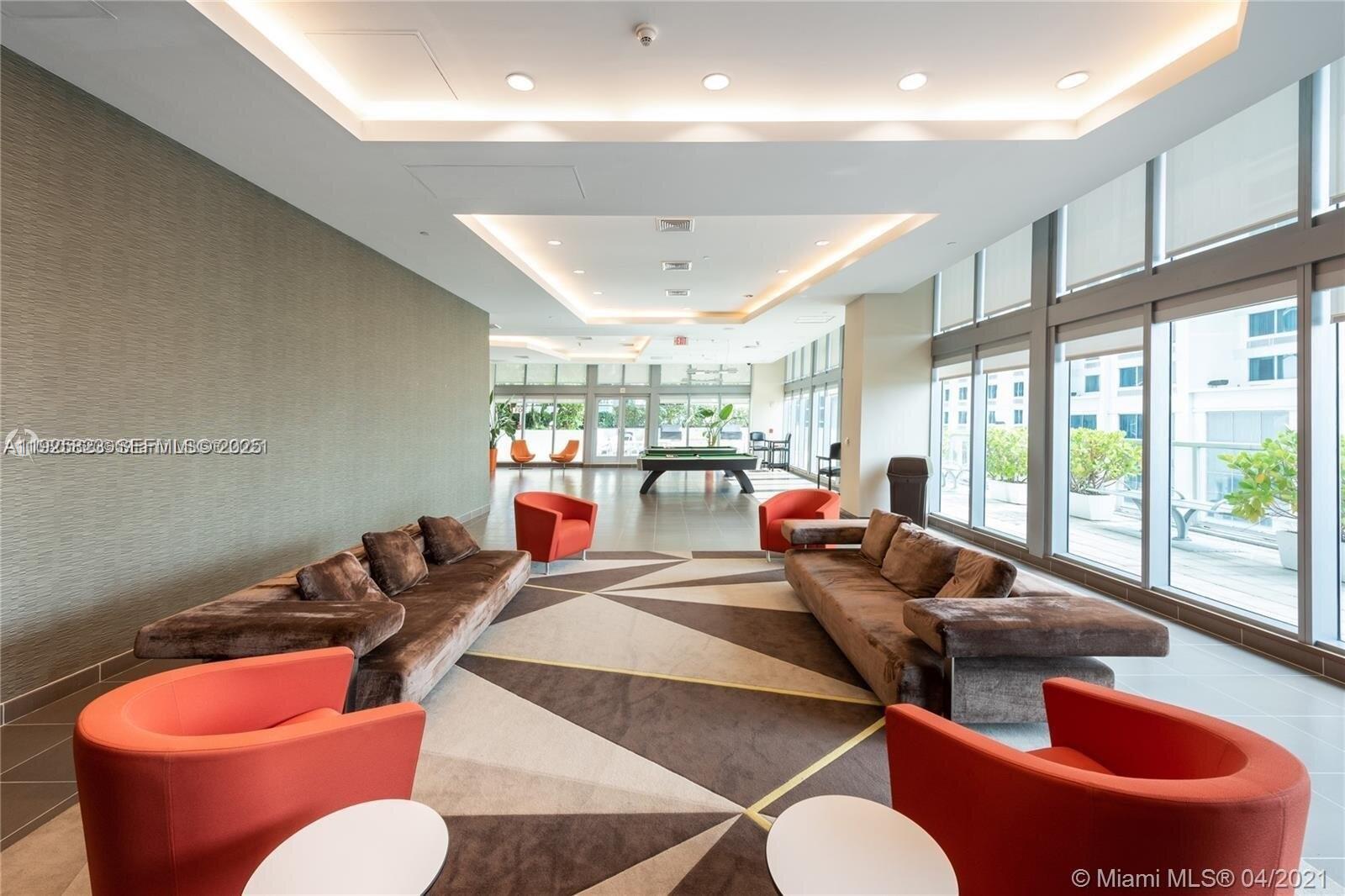 1111 Southwest 1st Avenue, Unit 2524N Miami, FL 33130 - Photo 3 of 11 a living room with furniture and a large window