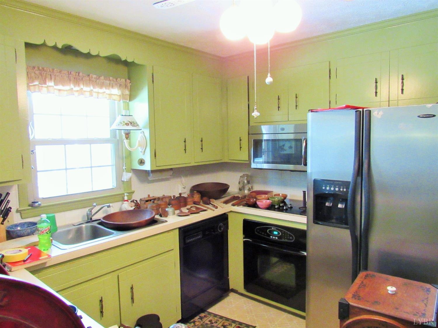739 Kenmore Road Amherst, VA 24521 - Photo 11 of 27 a kitchen with stainless steel appliances kitchen island granite countertop a sink stove and refrigerator
