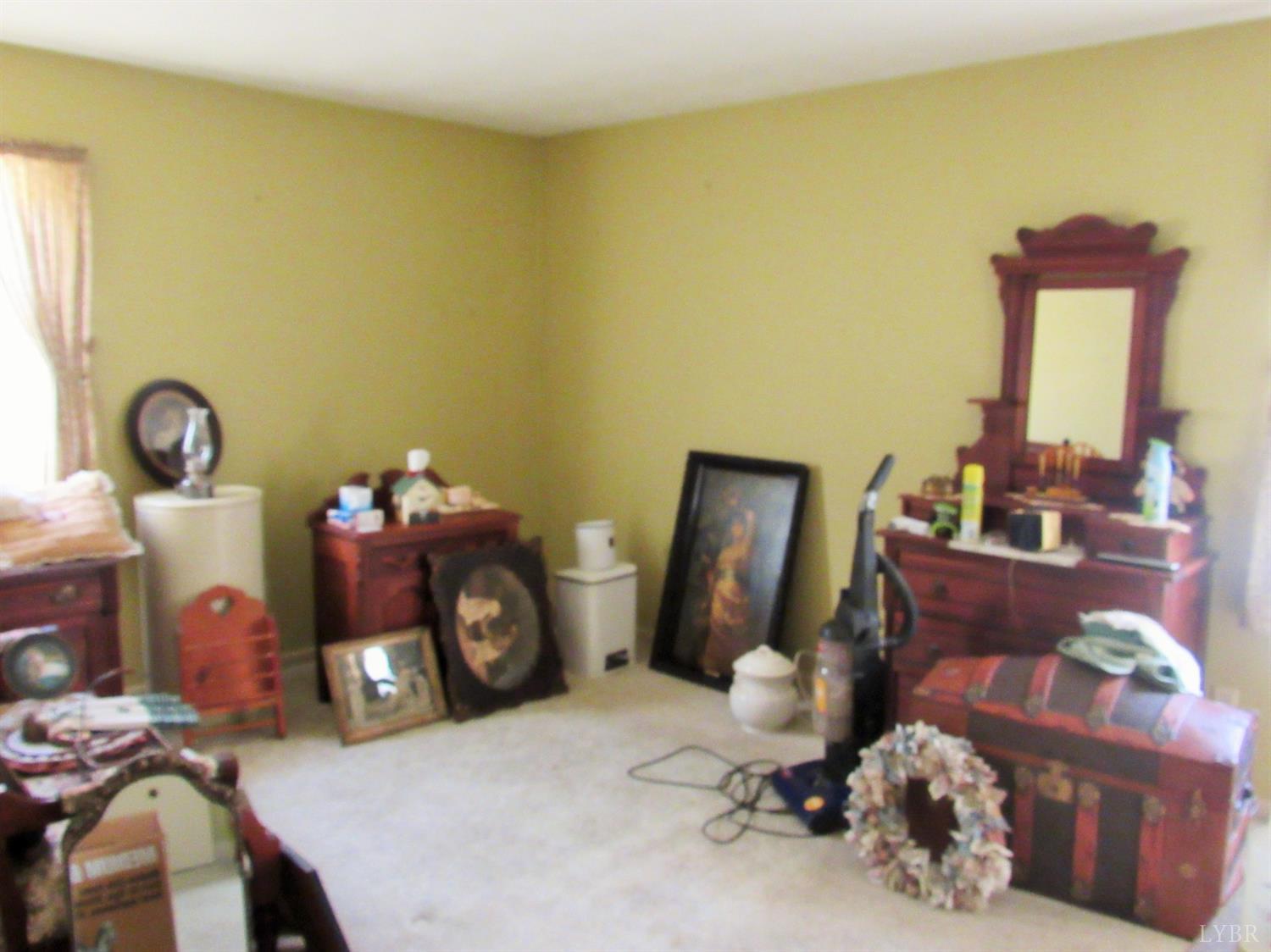 739 Kenmore Road Amherst, VA 24521 - Photo 12 of 27 a bedroom with a bed and wooden floor