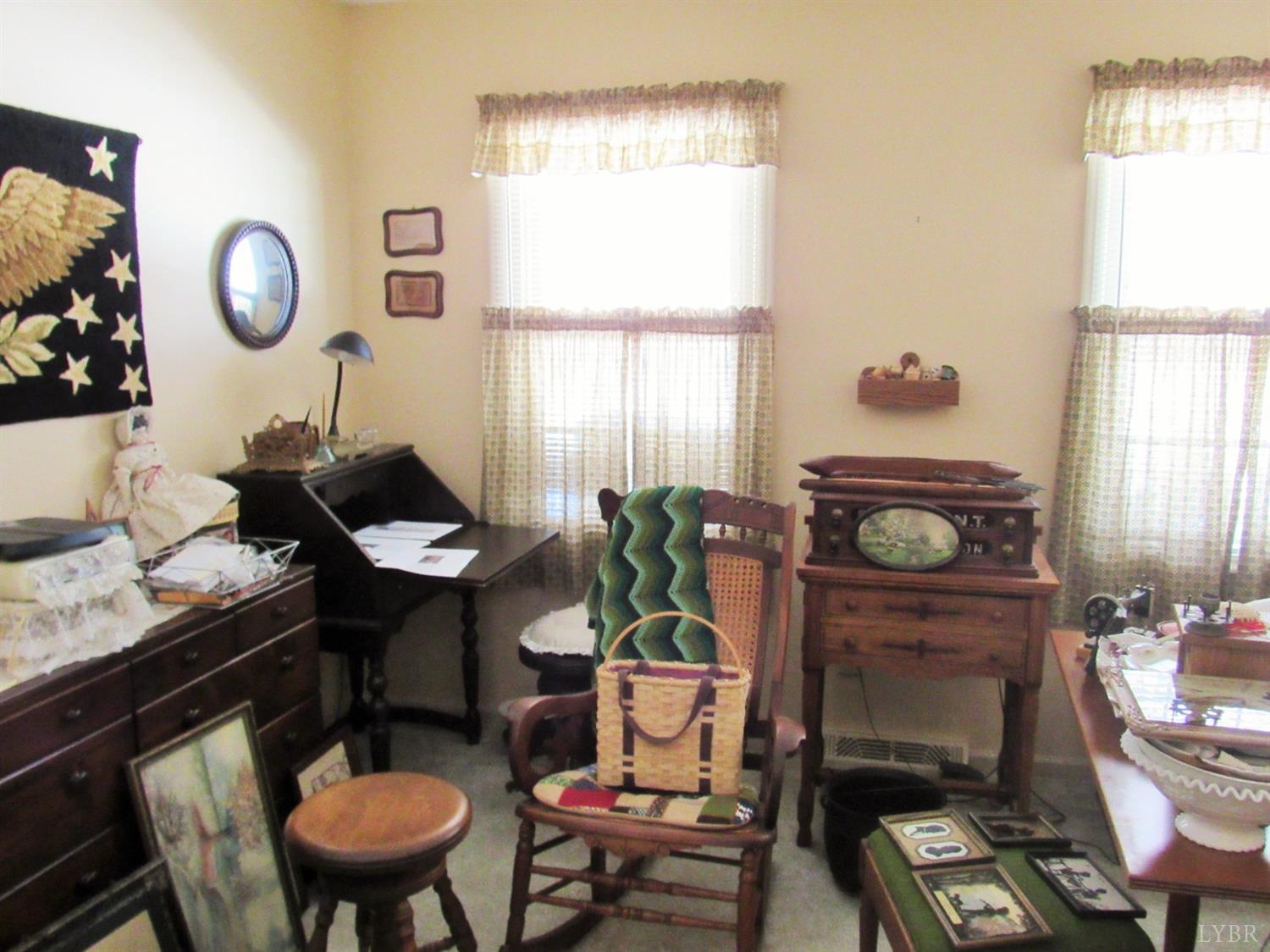 739 Kenmore Road Amherst, VA 24521 - Photo 14 of 27 a living room with furniture a window and a potted plant