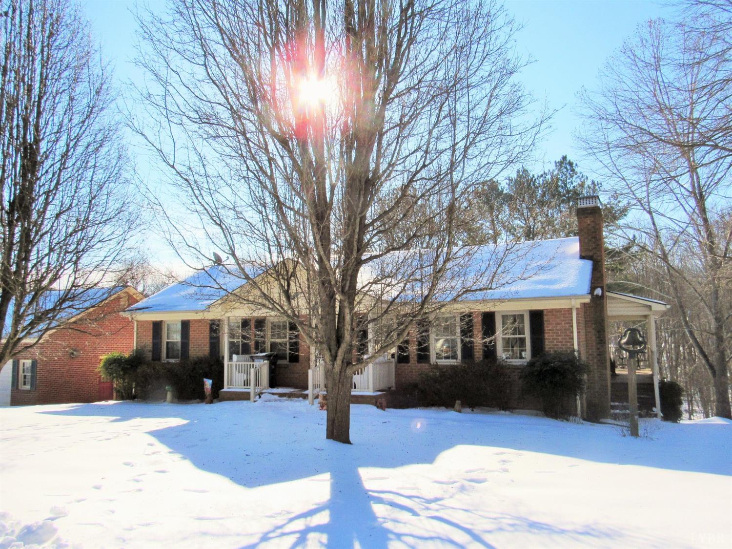 739 Kenmore Road Amherst, VA 24521 - Photo 2 of 27 a front view of a house with a yard covered in snow
