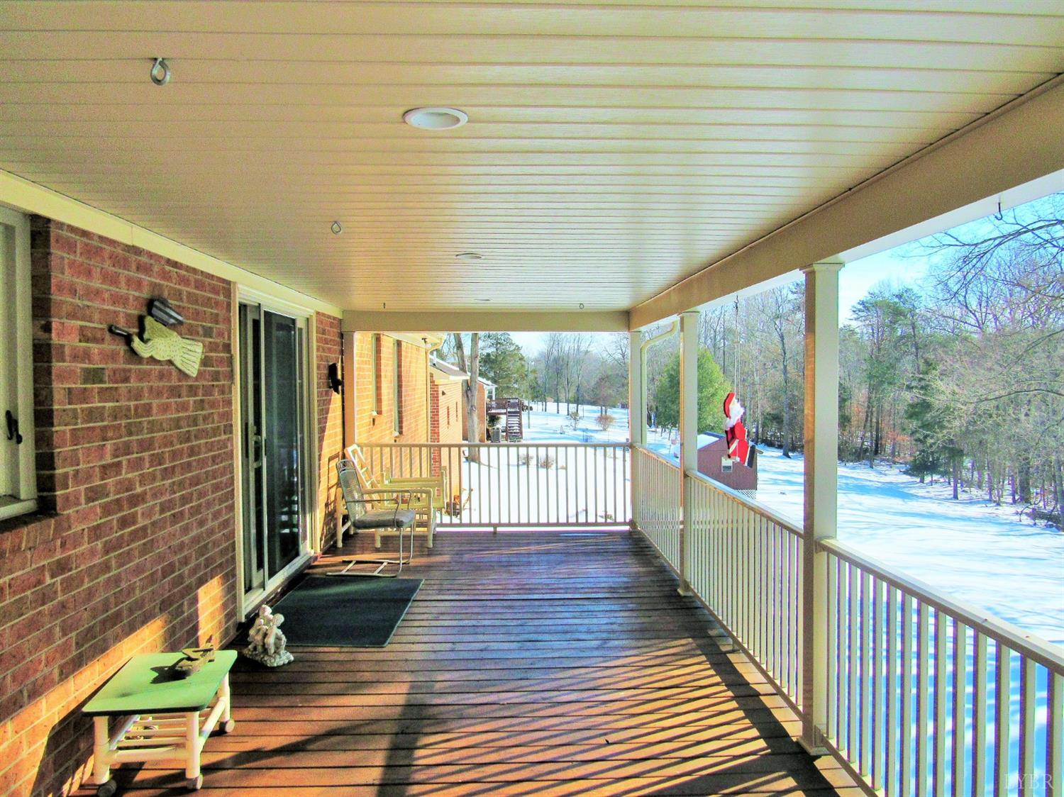 739 Kenmore Road Amherst, VA 24521 - Photo 23 of 27 a view of a patio with wooden floor and iron stairs