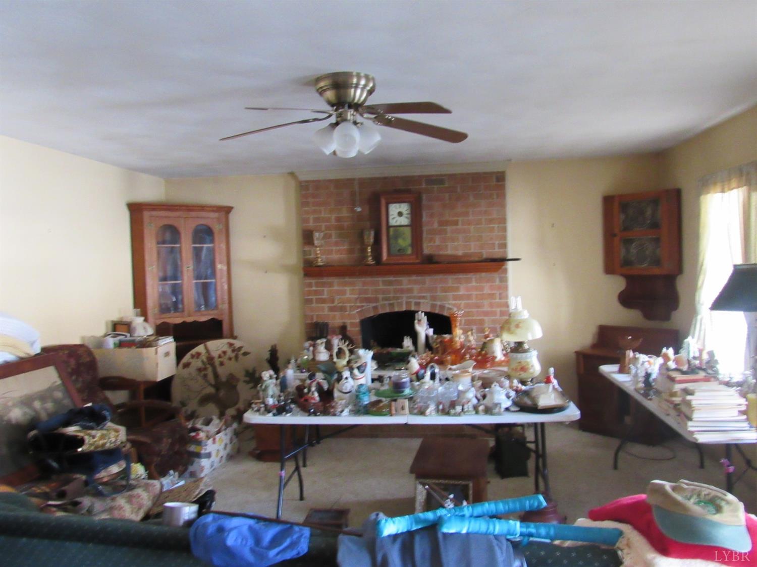 739 Kenmore Road Amherst, VA 24521 - Photo 9 of 27 a living room with furniture and a fireplace