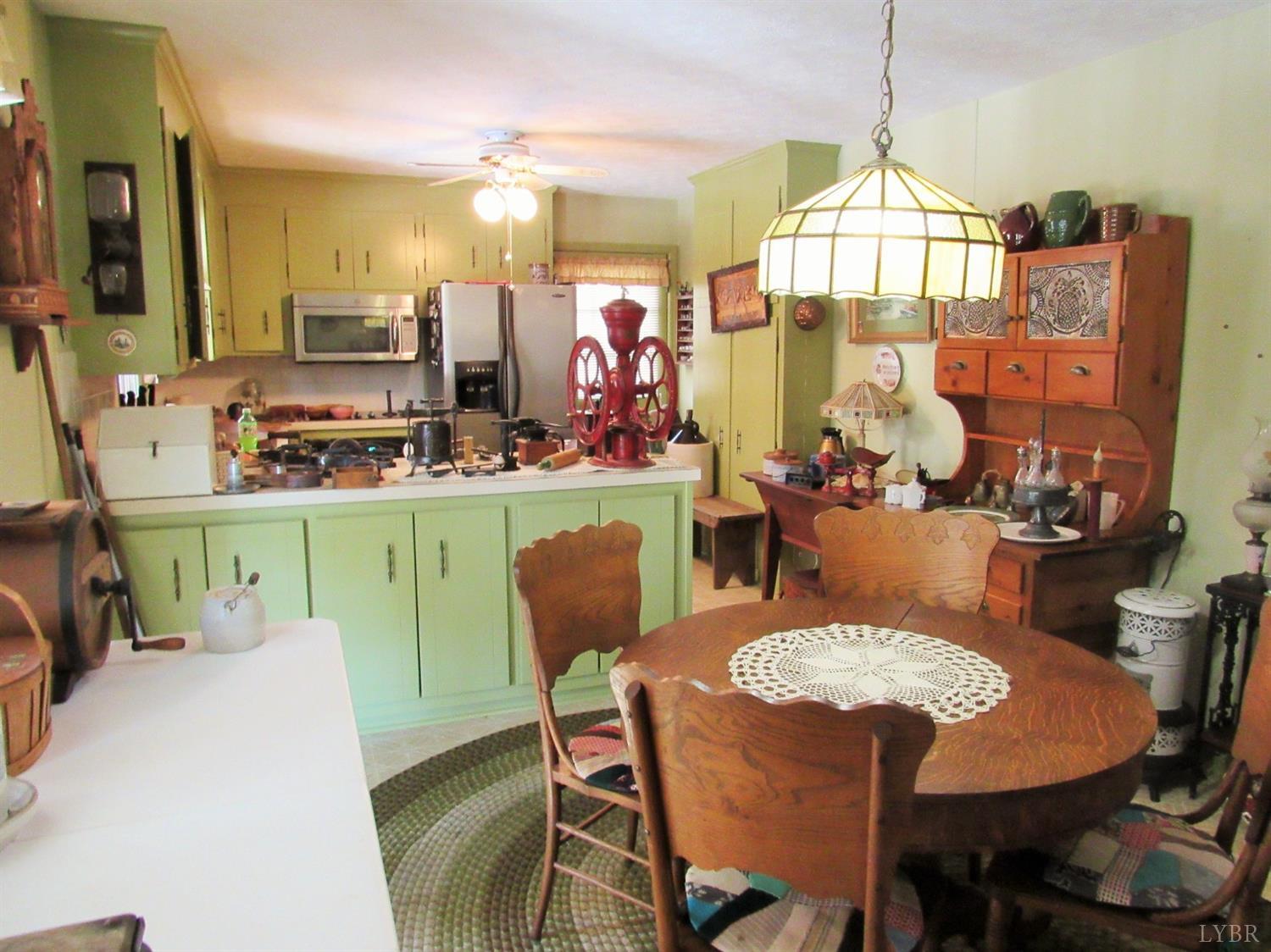 739 Kenmore Road Amherst, VA 24521 - Photo 10 of 27 a view of a dining room with furniture and a chandelier