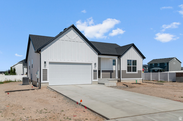 3016 West 2650 North Clinton, UT 84015 - Photo 2 of 20 Modern farmhouse style home with board and batten siding, covered porch, concrete driveway, a garage, and a shingled roof
