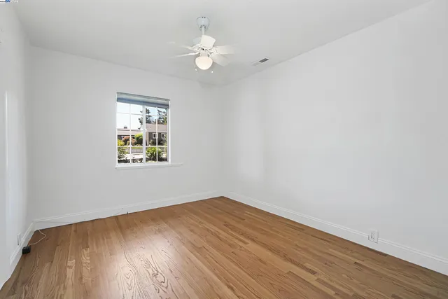 a view of a house with wooden deck