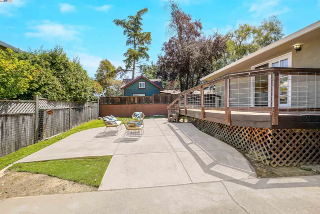 a view of a house with a yard and garage
