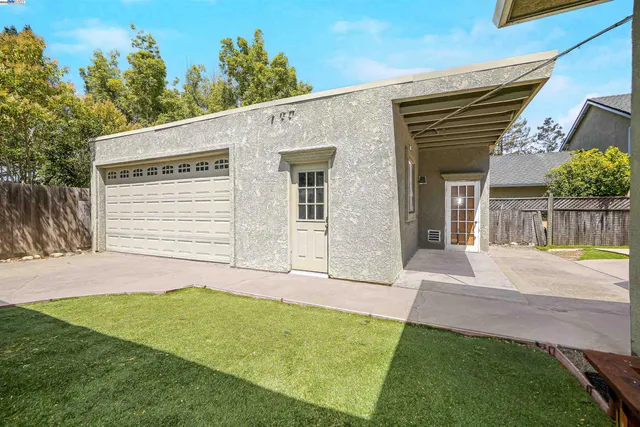 a view of a house with a snow in the yard