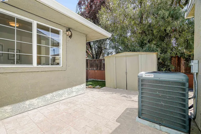 an aerial view of a houses with a swimming pool