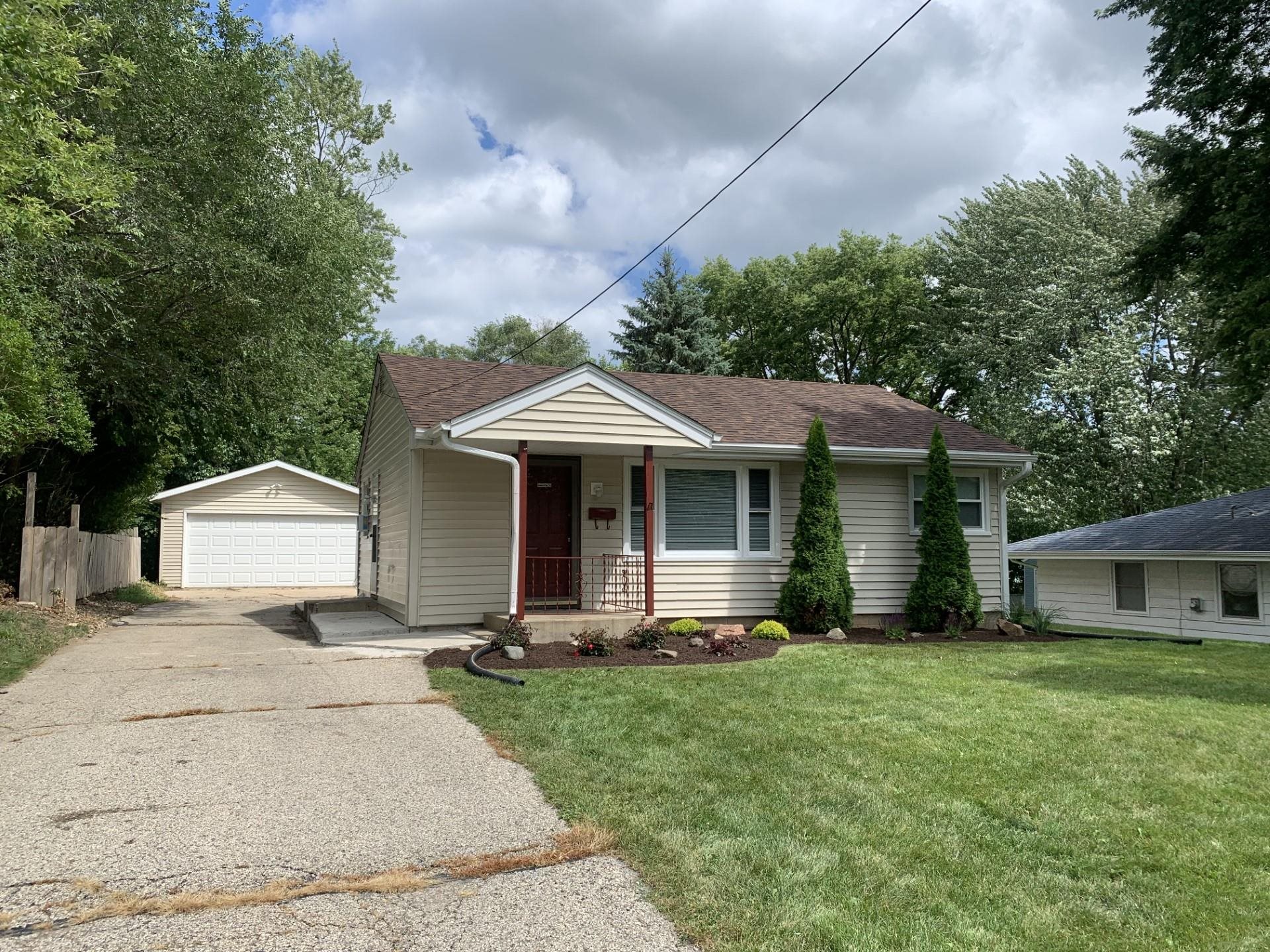 2020 Ridgeland Road Rockford, IL 61108 - Photo 3 of 19 a front view of a house with a yard