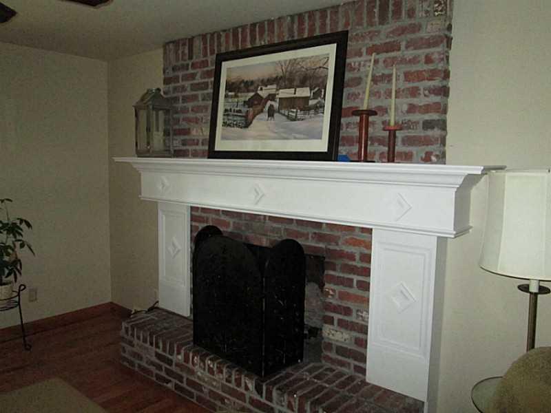 518 Iron Bridge Road Kittanning, PA 16201 - Photo 11 of 25 Living Room. Beautiful brick fireplace in the living room.