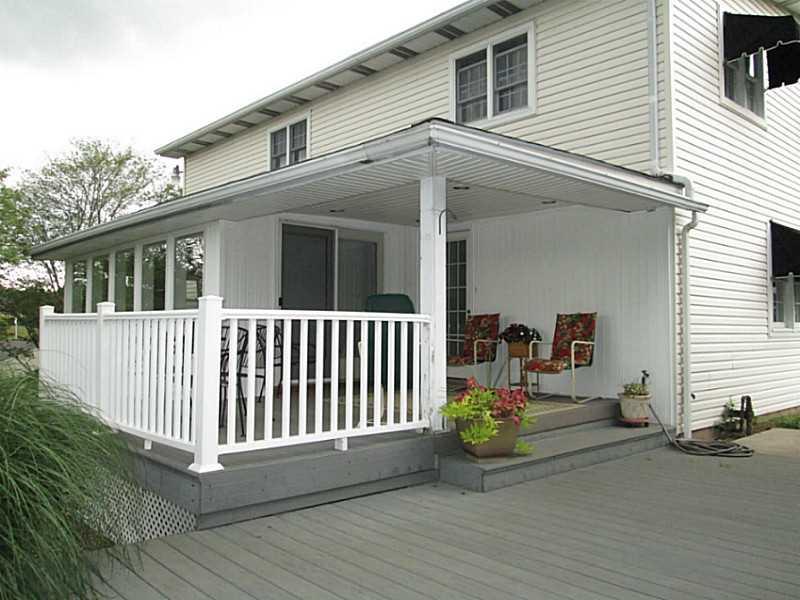 518 Iron Bridge Road Kittanning, PA 16201 - Photo 3 of 25 Exterior Back. Covered rear porch with huge deck overlooking the pool and ground. All composite, maintenance free decking.