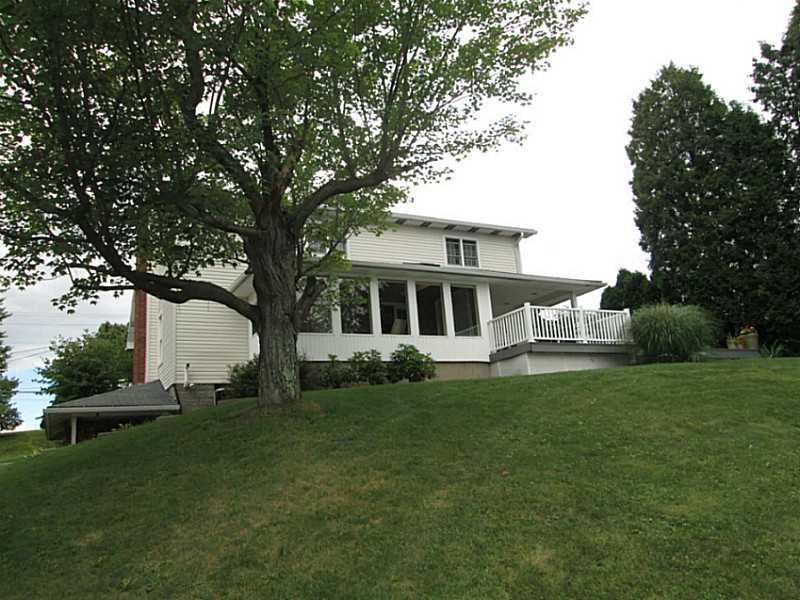 518 Iron Bridge Road Kittanning, PA 16201 - Photo 4 of 25 Exterior Back. Rear of the home showing the Den/sunroom and porch, patio overlooking the pool and 2.75 Acres.