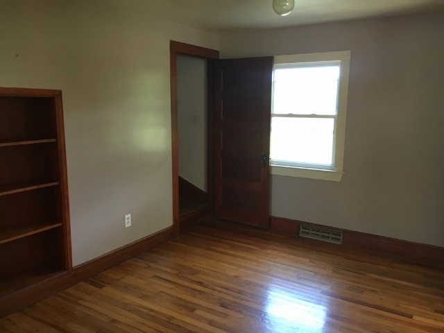 1882 Shutterlee Mill Road Staunton, VA 24401 - Photo 4 of 20 an empty room with wooden floor and windows