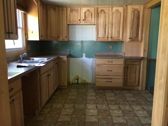 1882 Shutterlee Mill Road Staunton, VA 24401 - Photo 7 of 20 a kitchen with cabinets appliances and a window